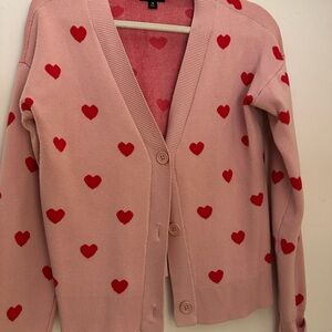 Cozy Pink Cardigan with Red Heart Pattern